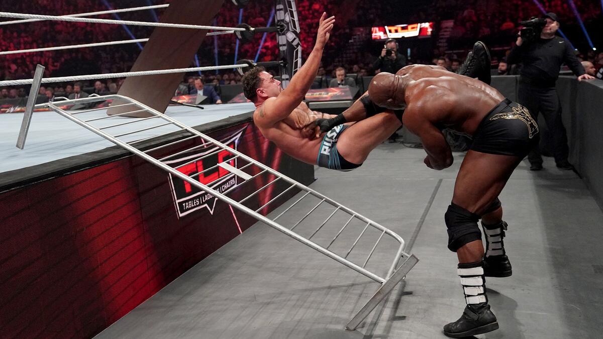 Bobby Lashley slams Rusev into a barricade rail