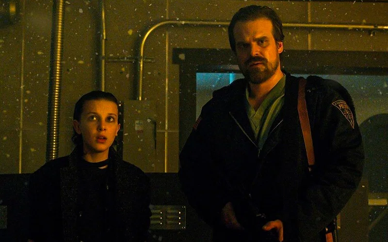 millie bobby brown and david harbour in stranger things