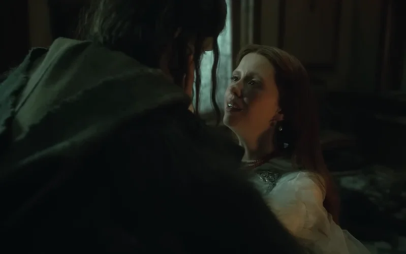 The creature looking at a woman in Frankenstein