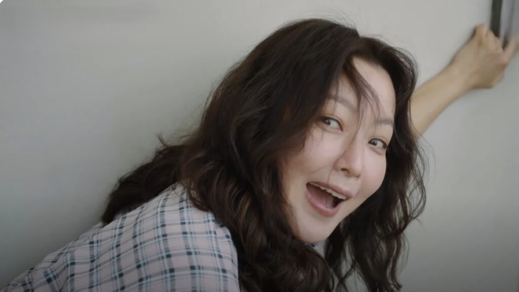 No Next Life Season 1 Episode 2: Release Date, Time & Where to Watch 49 Kim Hee-sun from No Next Life expressing excitement while crouching down down in a plaid shirt and reaching to a switch-board on the wall