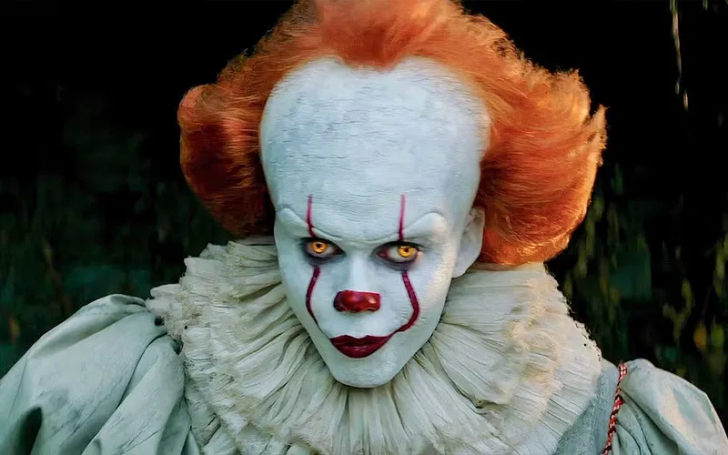 This IT: Welcome to Derry Fan Theory Gives Spine-Chilling Explanation of How Pennywise Tortures Its Victims for Eternity Bill Skarsgård As Pennywise In The Film "IT"