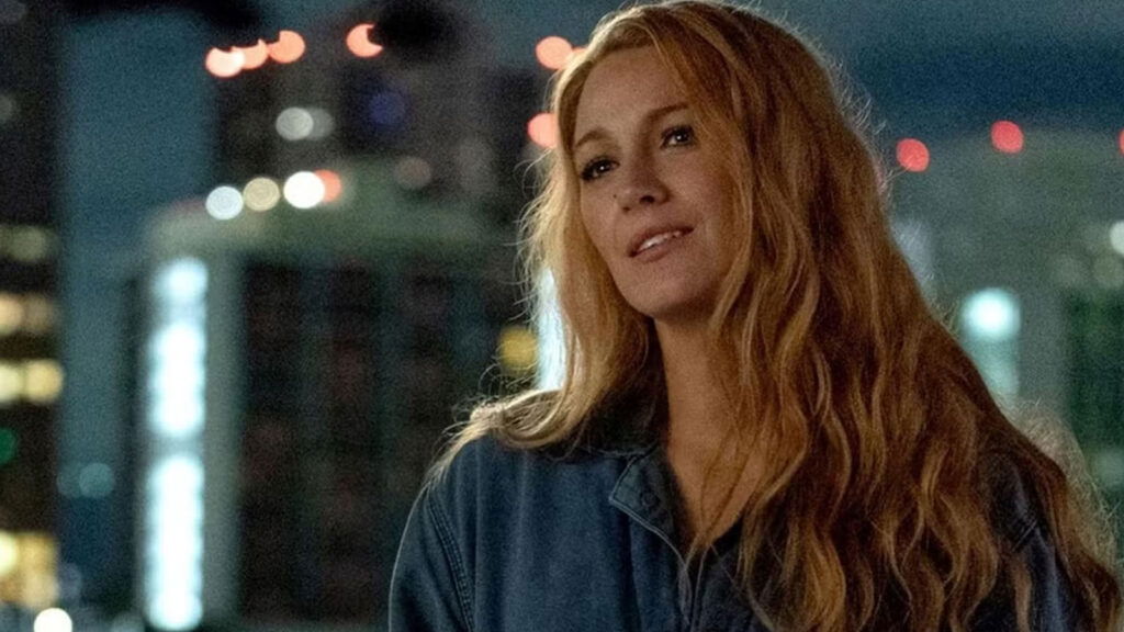 blake lively's character smilles with her head titled to the side in It Ends With Us