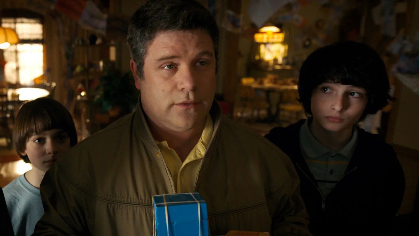 Bob Newby (Sean Astin) with Will Byers (Noah Schnapp) and Mike Wheeler (Finn Wolfhard) in a scene from Stranger Things Season 2