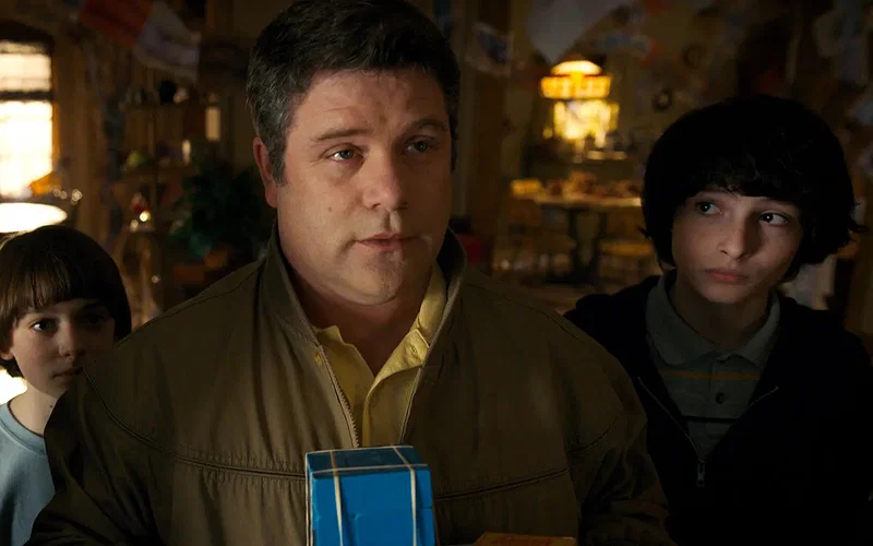 Bob Newby (Sean Astin) with Will Byers (Noah Schnapp) and Mike Wheeler (Finn Wolfhard) in a scene from Stranger Things Season 2