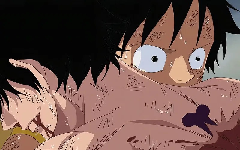 Luffy holds a dying Ace in One Piece.