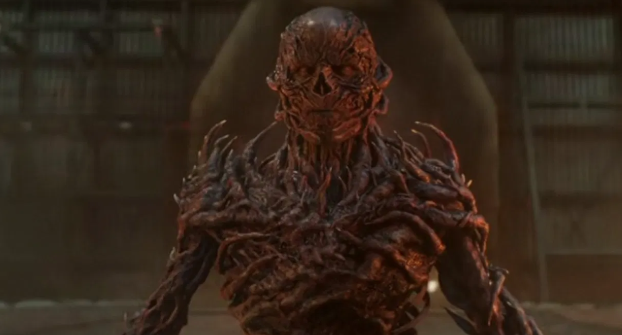 The terrifying main villain, Vecna, in his full monstrous form, made of vines and flesh from the Upside Down.