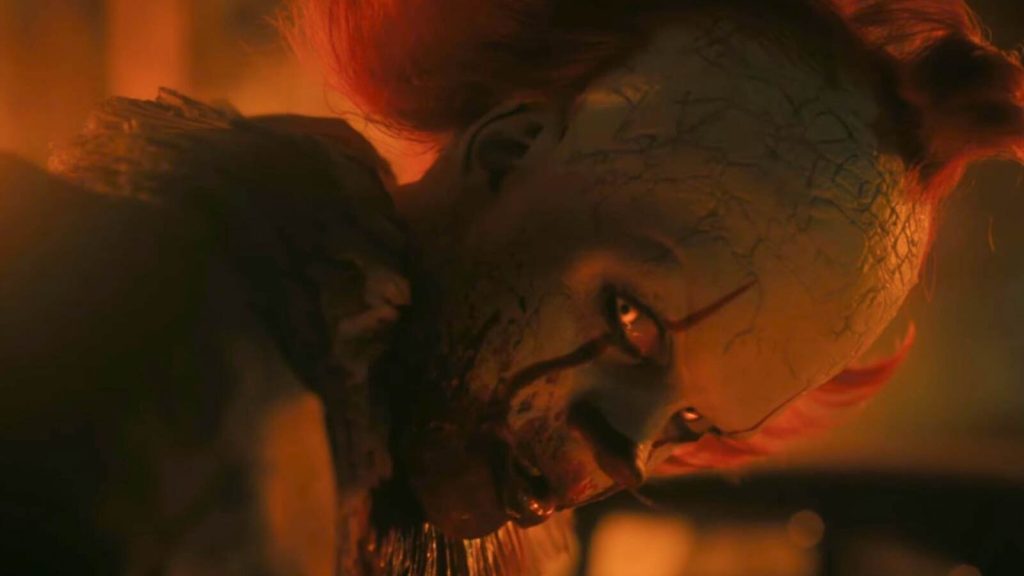 A horrifying image of Pennywise the clown in IT: Welcome to Derry
