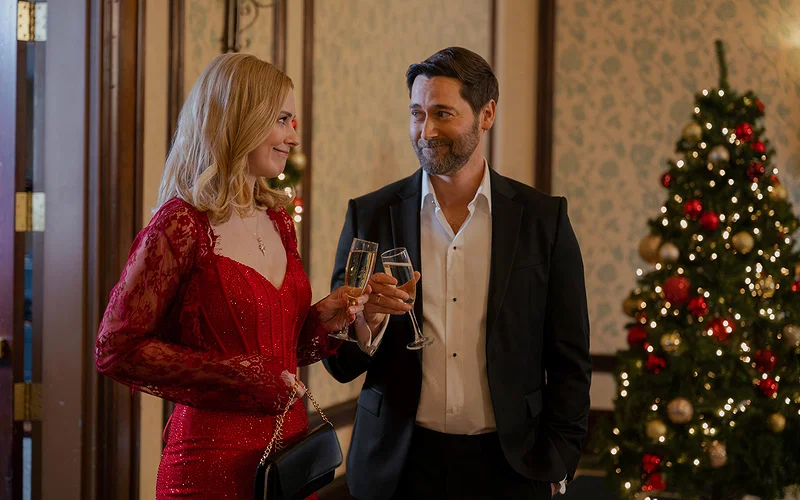 A still from My Secret Santa featuring Taylor and Matthew in formal attire.