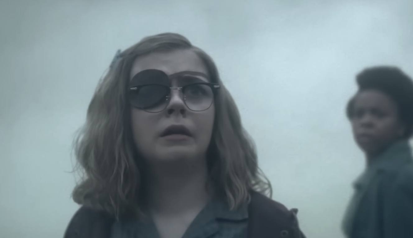 A character in IT: Welcome to Derry, surrounded by fog. 