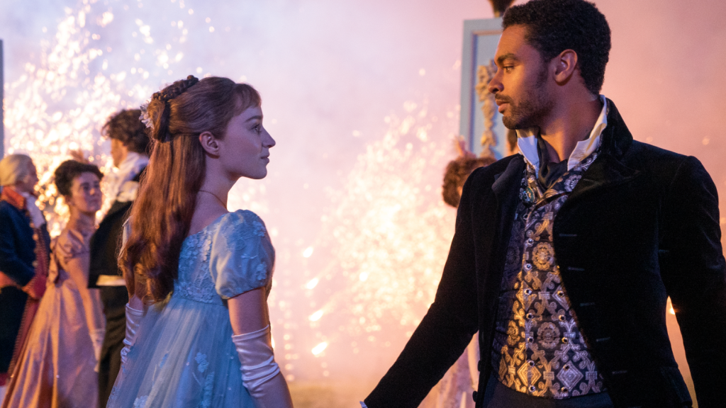 Simon and Daphne, dancing and fireworks behind them in Bridgerton