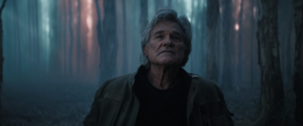 A still from Monarch: Legacy of Monsters Season 2 featuring Lee standing in a forest
