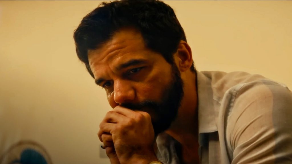 Wagner Moura as Armando in The Secret Agent, wearing a pale shirt 