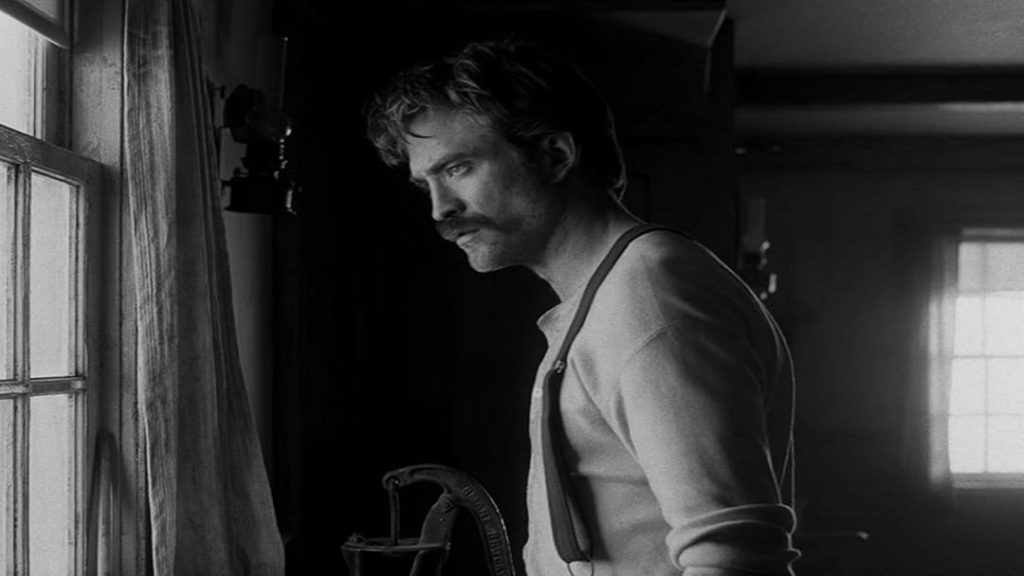 Robert Pattinson as Ephraim Winslow in The Lighthouse