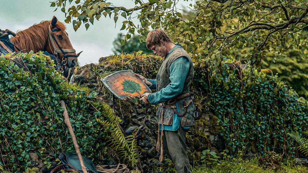 peter claffey as ser duncan the tall looking at his broken shield on a knight of the seven kingdoms