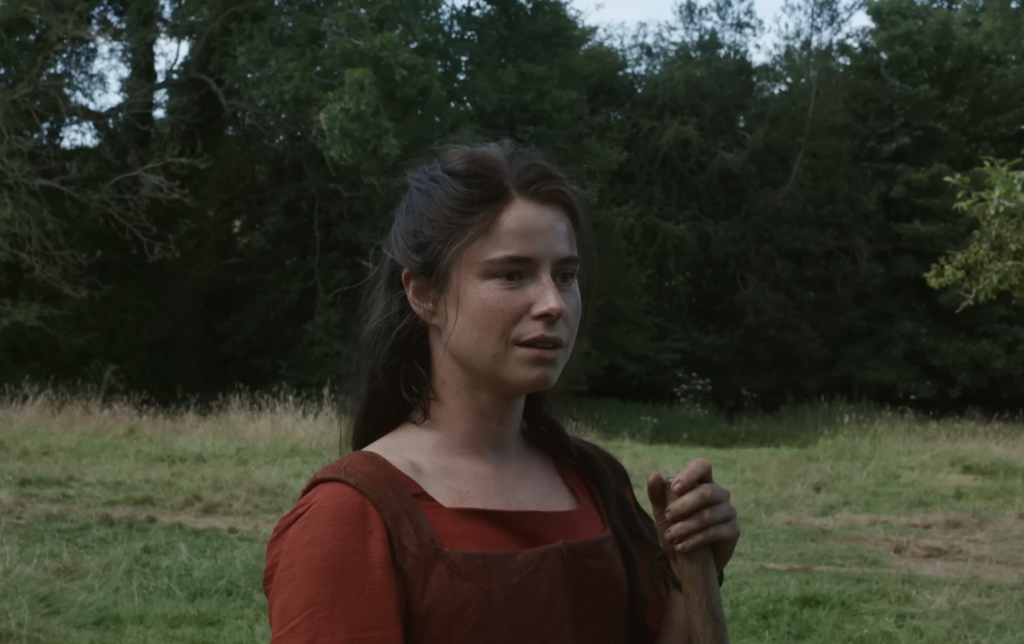 Jessie Buckley in a red dress 