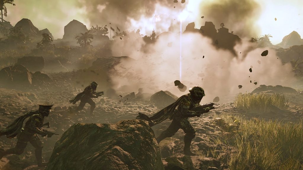 A cinematic shot from the latest Helldivers 2 warbond trailer showing a squad of three players advancing through the battlefield. 