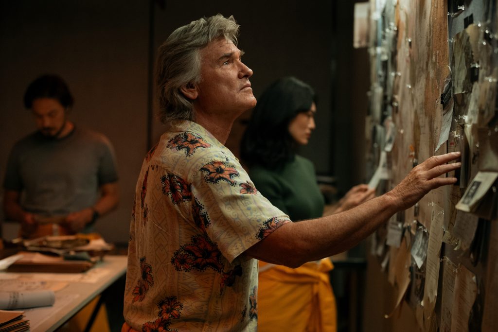 A still from Monarch: Legacy of Monsters Season 2 featuring Shaw looking at a conspiracy board