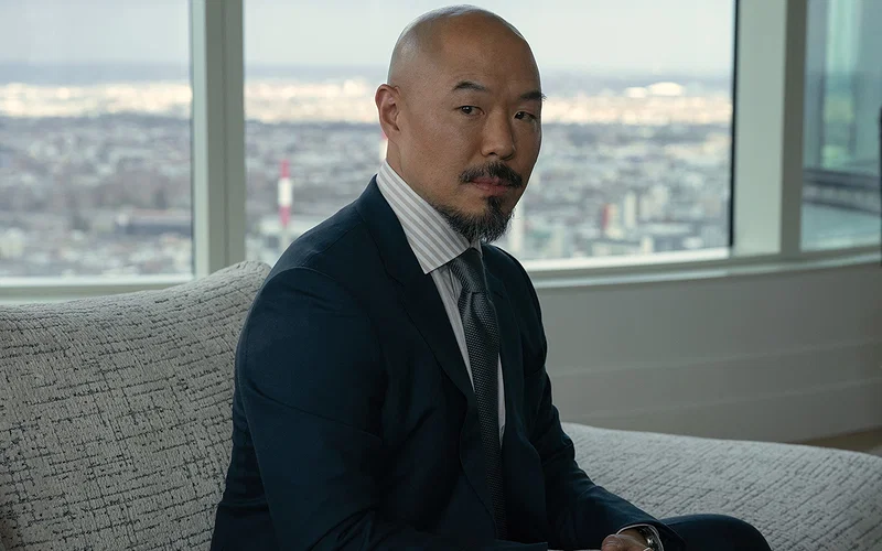 The Theory Behind Ashe’s Master Plan 17 Hoon Lee in "Your Friends & Neighbors," premiering April 3, 2026 on Apple TV.