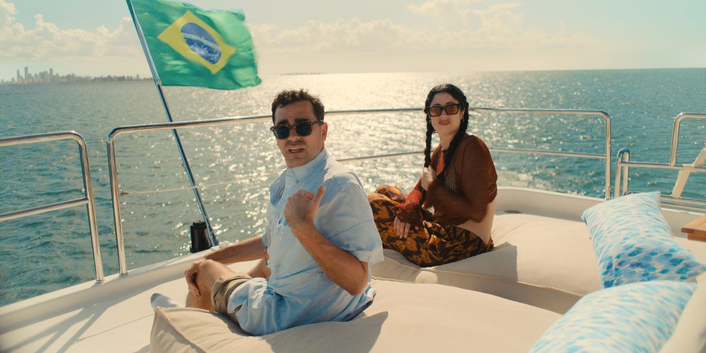 (L to R) Dan Levy as Nicky and Taylor Ortega as Morgan in Big Mistakes.