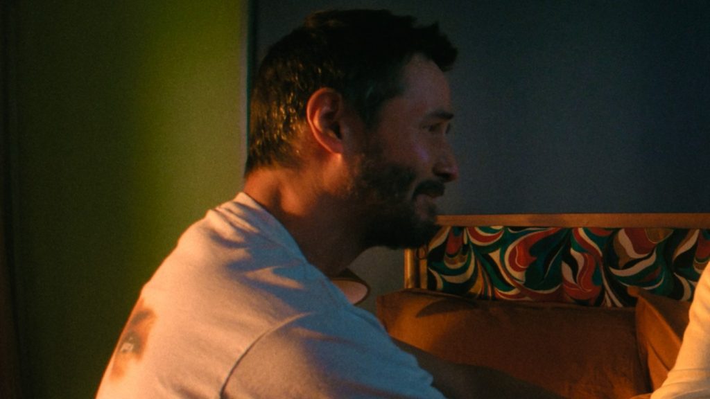 keanu reeves in a still from outcome 