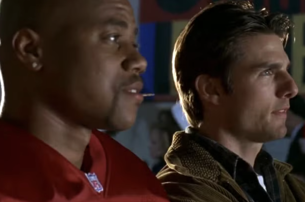 Jerry and Rod standing together in Jerry Maguire 