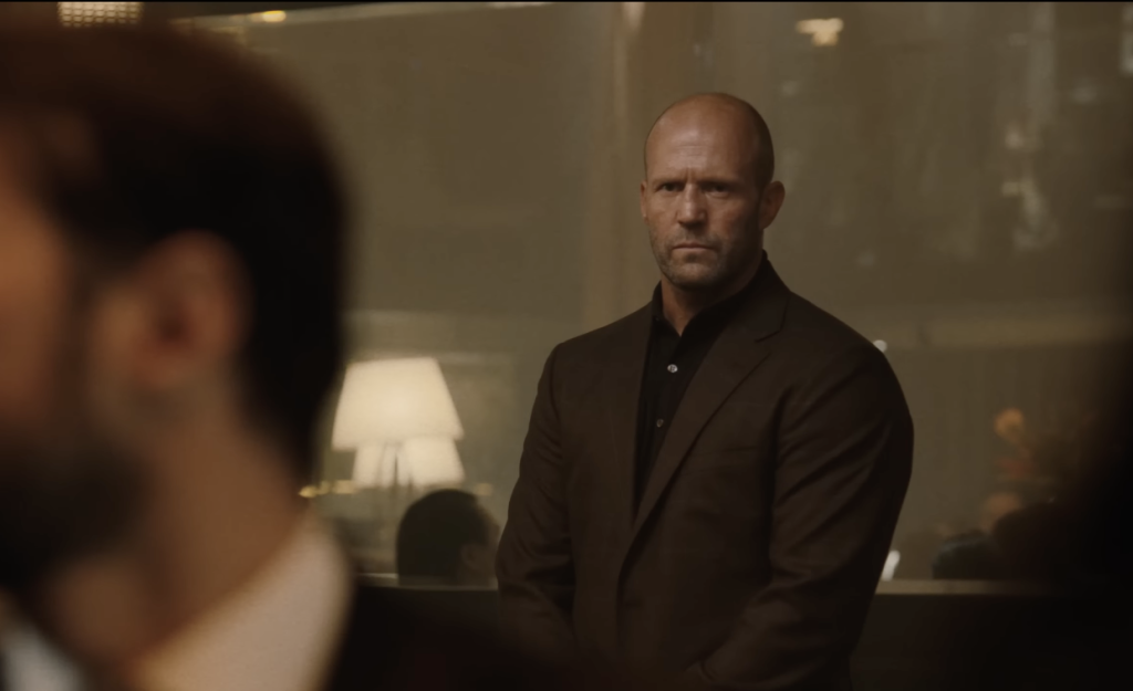 Jason Statham in Mutiny, wearing a suit 