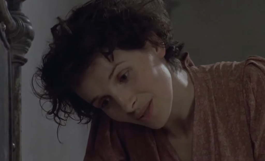 A woman with short hair in The English Patient 