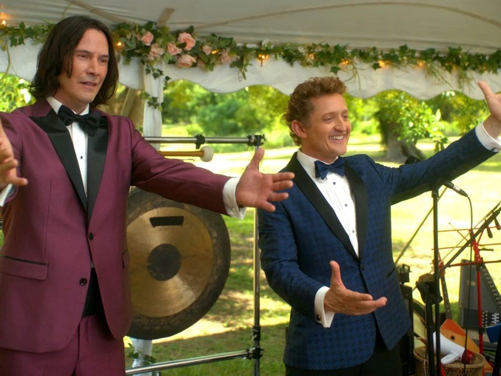 Alex Winter and Keanu Reeves, opening arms, in a still from Bill & Ted Face the Music