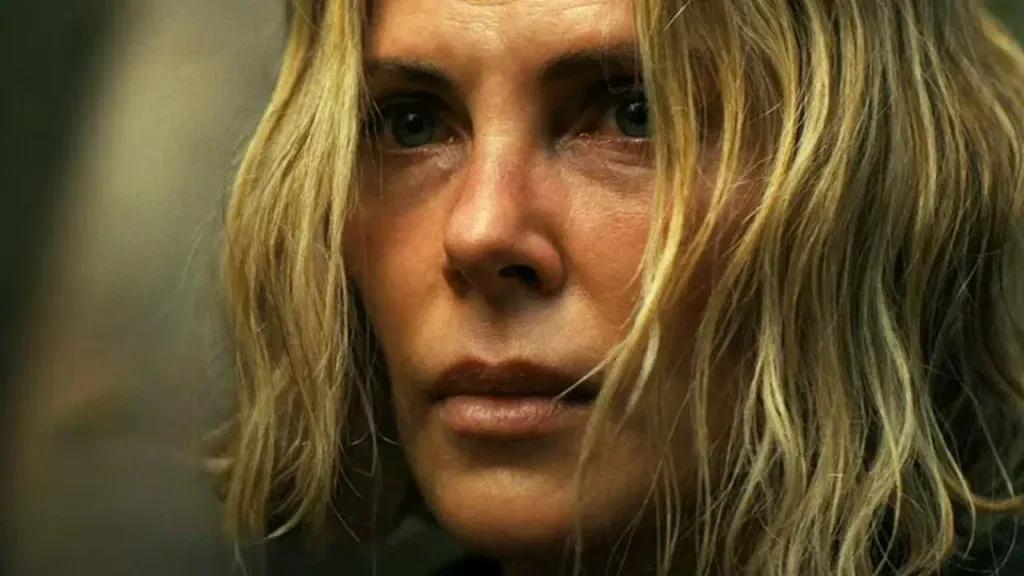 Charlize Theron with blonde hair in Apex 