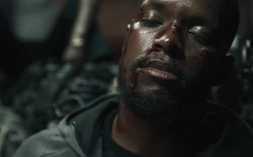 An injured man in Netflix's South African movie, 180. 