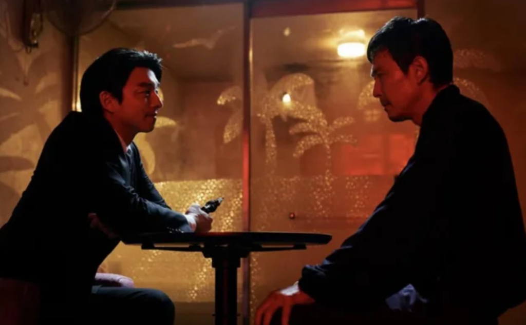 The Recruiter and Gi-hun playing Russian Roulette in Squid Game Season 2