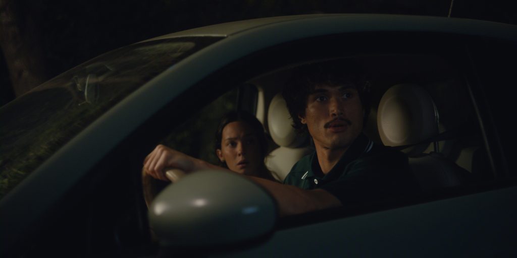 Beef. (L to R) Cailee Spaeny as Ashley Miller, Charles Melton as Austin Davis in episode 201 of Beef. Cr. Courtesy of Netflix © 2026