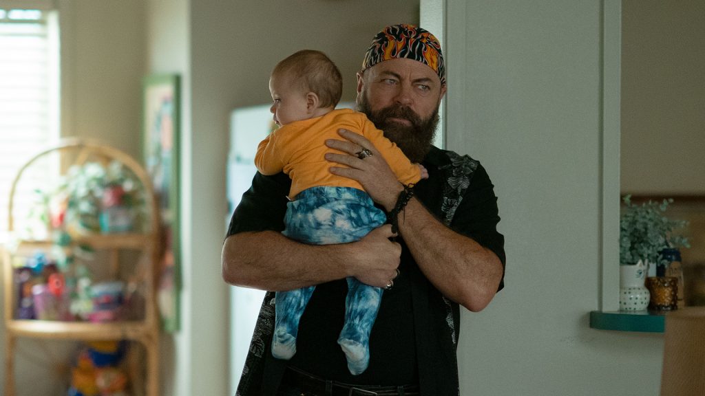 Nick Offerman, holding a baby in Margo's Got Money Troubles