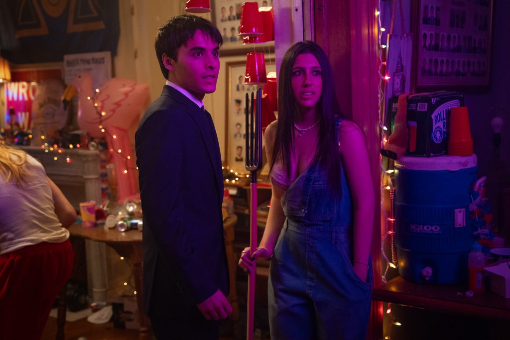 Billy Bryk as Michael and Sadie Sandler as Devon at the party in Roommates.