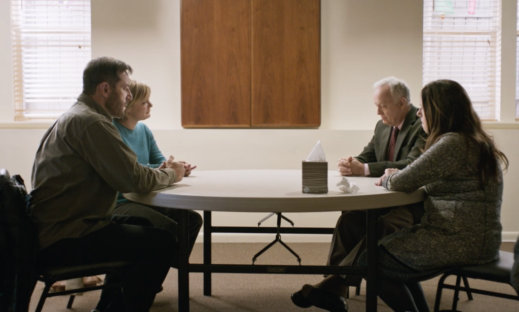 Reed Birney, Ann Dowd, Jason Isaacs, and Martha Plimpton sitting together 