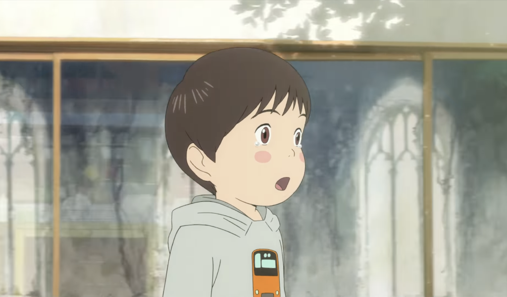 kun stares at something with tears in his eyes and wonder all over his face in mirai anime film