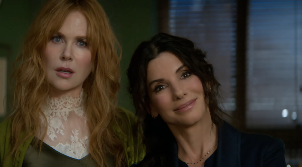 Nicole Kidman and Sandra Bullock standing next to each other in Practical Magic 2