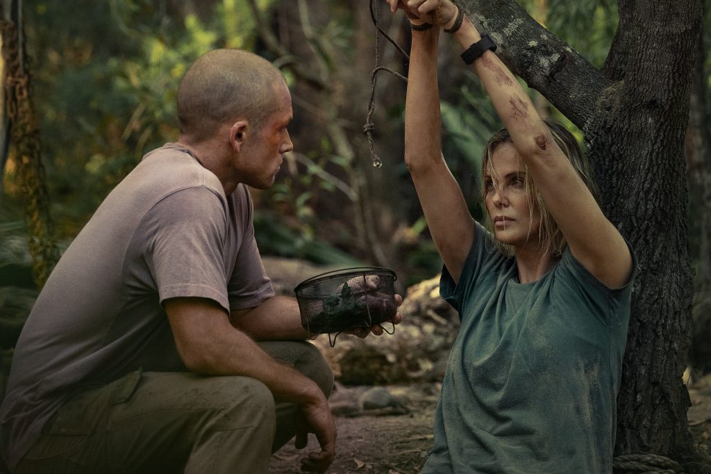 Charlize Theron is held captive by Taron Egerton in APEX. 