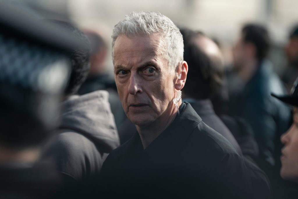 Peter Capaldi finds himself in a crowd in CRIMINAL RECORD.