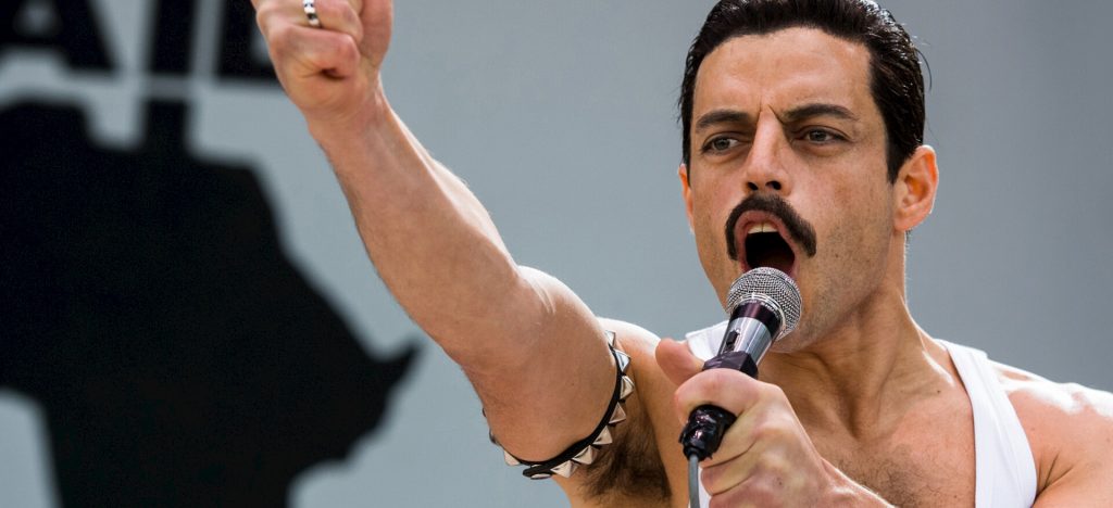 Rami Malek as Freddie Mercury, singing to the crowd in Bohemian Rhapsody, the no. 1 competitor of Michael 
