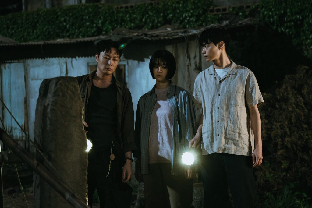 teenagers standing in a still from if wishes could kill