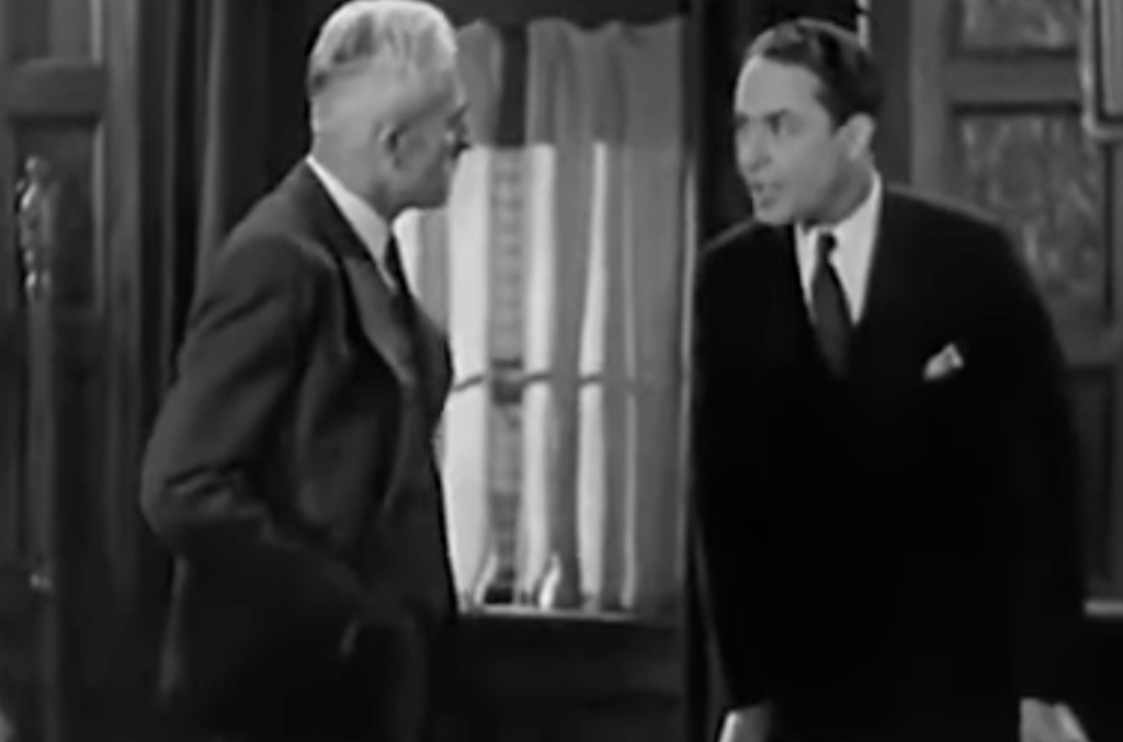 Two men wearing suits 