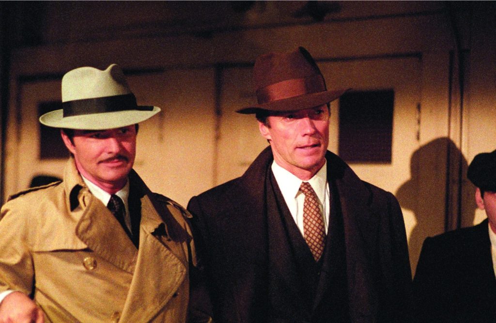 Burt Reynolds and Clint Eastwood as Detectives interrogating