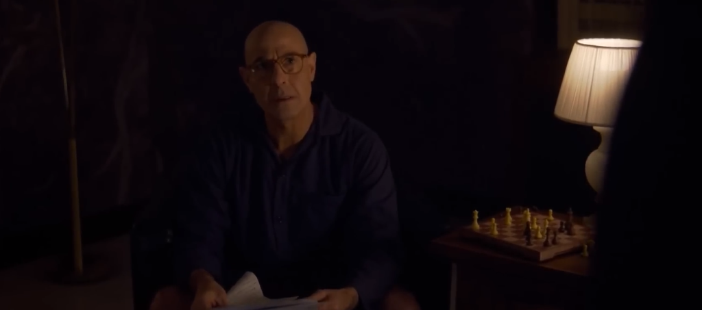 Stanley Tucci as Cardinal Bellini in Conclave looking seriously