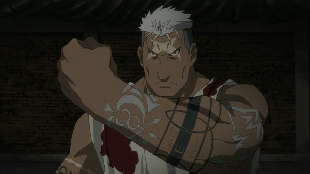Scar showing his tattoos. 