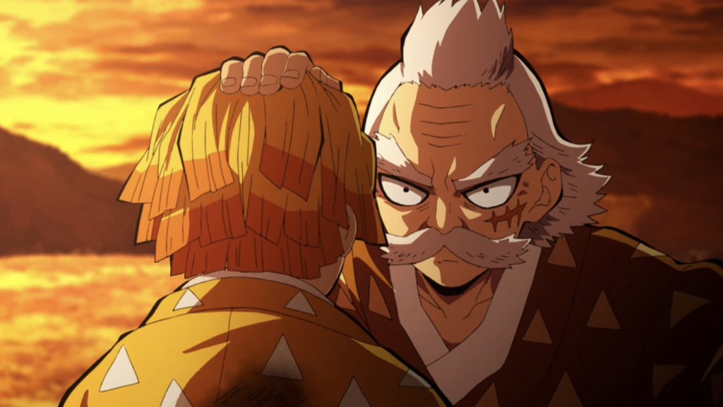 a still scene of Jigoro Kuwajima patting zenitsu's head in a flashback moment in demon slayer