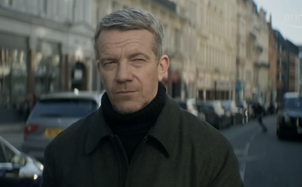 Max Beesley standing on a street 