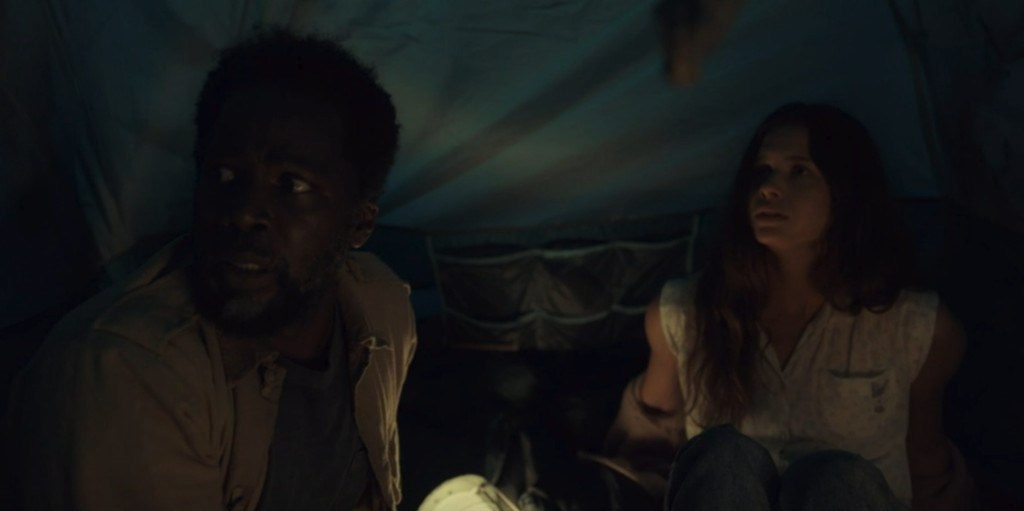 Boyd and Sara inside a tent in FROM