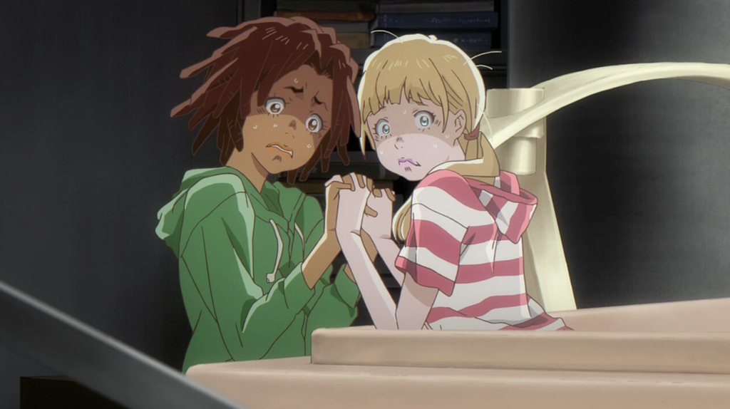 a still shot of a scared carole and tuesday holding each other's hands 