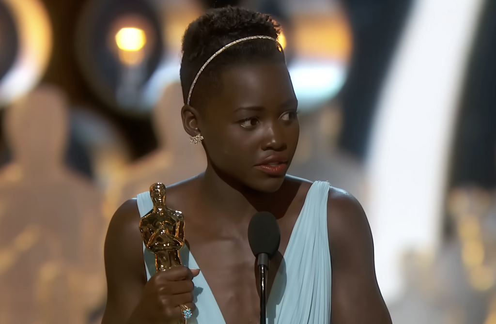 Lupita Nyong’o receiving her Oscar